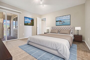 A cozy bedroom featuring a large bed and a stylish sliding glass door
