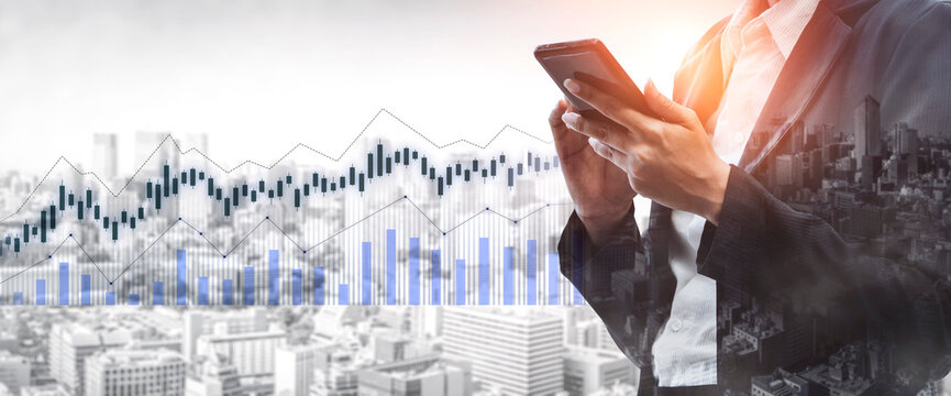 A business professional uses a smartphone to analyze market trends amidst a bustling city skyline, showcasing financial graphs and data visualization. Scalp