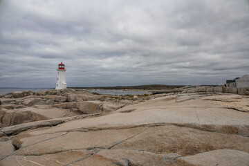Peggy's Cove Lighthouse stands as a timeless beacon against the rocky shores of Nova Scotia's picturesque coastline.