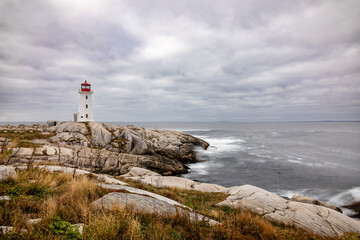 Peggy's Cove Lighthouse stands as a timeless beacon against the rocky shores of Nova Scotia's picturesque coastline.