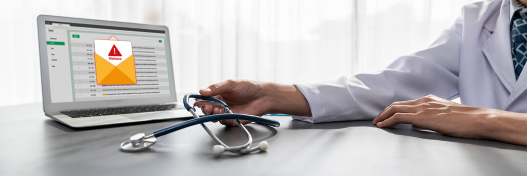 Cyber attacking concept. Malware alert showing on computer screen display scam and threat detection on computer system or online server to be removed brisk.