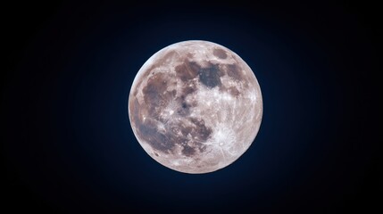 Obraz premium Full moon against a dark sky, with a subtle glow and some clouds visible.