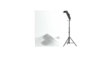 Studio setup Backdrop of sand dunes, light stand, and bright panel against a dark background