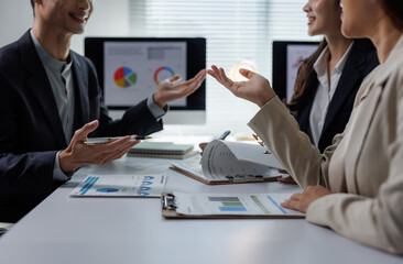 Business professionals discussing data during corporate meeting