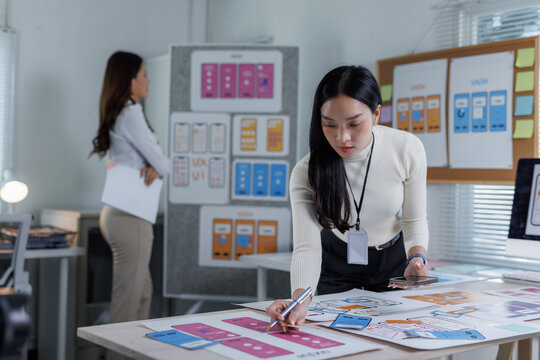 Designer planning user interface for mobile application