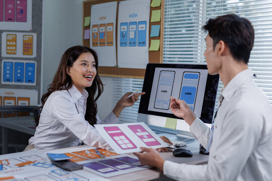 Ui ux designers collaborating on mobile app interface development