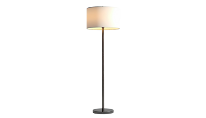 Simple floor lamp with a cylindrical shade glowing against a black backdrop