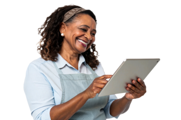 Smiling Black woman wearing an apron and headband uses a tablet for business or personal tasks, suitable for marketing, technology, or service industry applications.