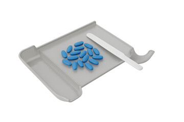 Blue pills on pill counting tray with spatula