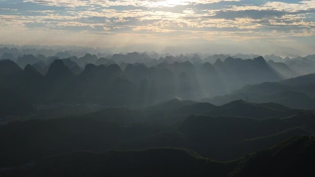 Golden Sunrise Over Karst Peaks in Southern China, Aerial View of a Magnificent Dawn