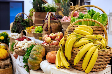 Fresh fruits vegetables are arranged in baskets at vibrant market, day harvest.