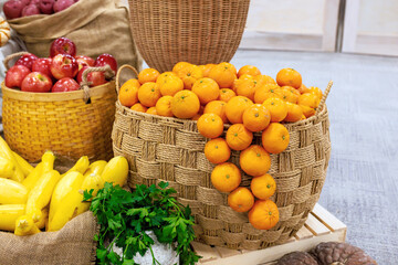 Colorful oranges fresh vegetables are arranged in baskets at vibrant local market