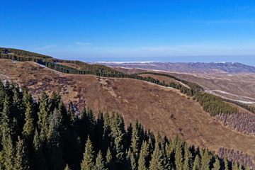 Ile-Alatau National Nature Park. The Tien Shan Mountains, an area with different vegetation, November. The view from the drone.