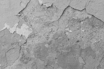 Background of cracked, damaged grey plaster.