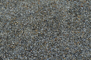 Closeup of black and white gravel or pebble stone texture background
