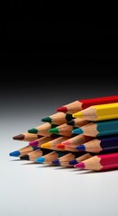 Fototapeta premium Assortment of vibrant wood-cased coloring pencils with thick, wax cores used for artistic drawing, sketching, and various educational or school projects ,drawing ,drawing supply ,education tool