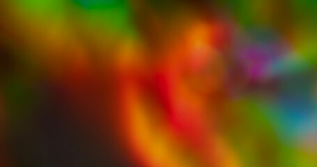 Defocused glow. Reflection leak. Red green colorful neon glossy texture illuminated abstract red orange vibrant twinkle on dark background.