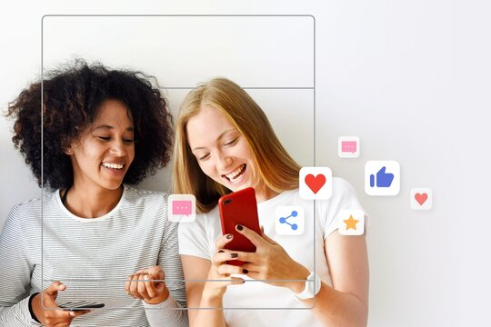 Happy friends using smartphone together social media concept