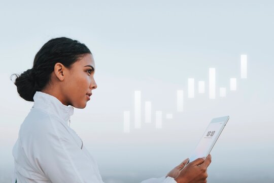 Woman looking at her digital tablet