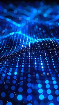An abstract visualization of a wavy, glittering blue surface created from countless small, spherical light sources. Bokeh effect emphasizes the depth