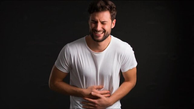 Upset Man Grabbing Stomach in Discomfort