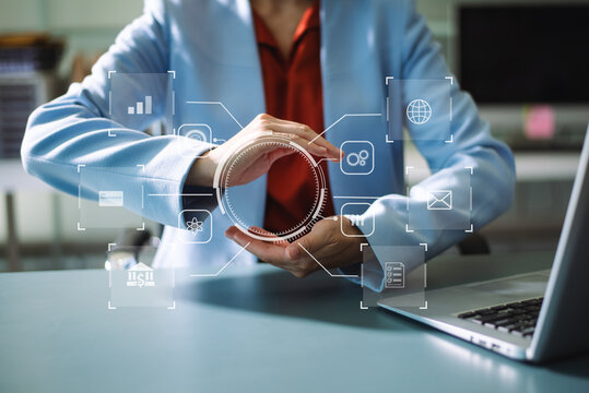 Businesswoman uses a tablet to analyze data on a virtual interface, symbolizing business innovation, technology, and global connection