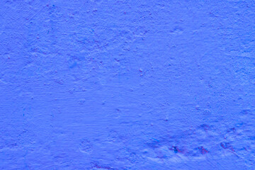 Close-up of an uneven, damaged concrete wall.