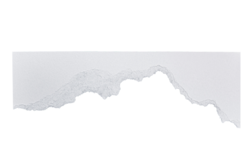 A close up shot of a torn piece of white paper against a black background in studio light