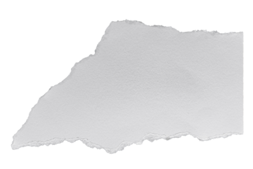 A single isolated white torn piece of paper on a black background studio shot close up