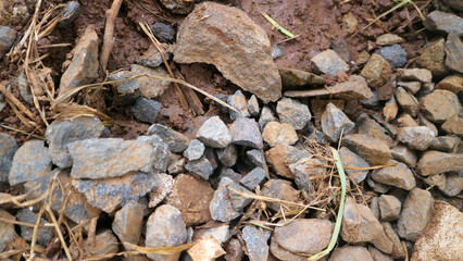 Close up view of scattered rocks on earthy ground