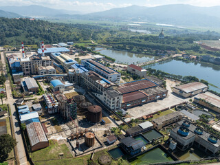 Fototapeta premium Aerial View of Large Industrial Sugar Factory Complex and Processing Plant