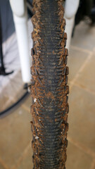 Close up view of a dirty mountain bike tire tread