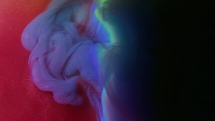 Paint spill. Shiny fluid. Red blue sparkling blob spreading on black background. Colorful rainbow light arch ink abstract blend blur water.