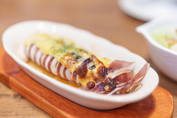 Grilled Squid with Cheese Sauce on plate