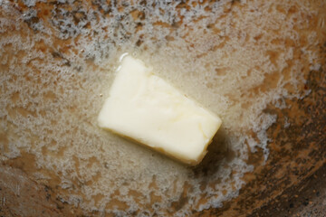 Butter melting in a pan on the stove