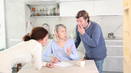 Man and woman help elderly mother make will and fill out document correctly. Family advice, help and support