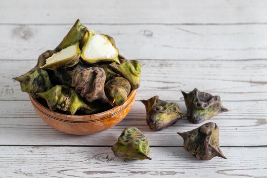 Water chestnut is a crunchy aquatic vegetable with sweet mild flavor, rich in fiber, antioxidants, vitamins, gluten-free, often used in snacks and curries.
