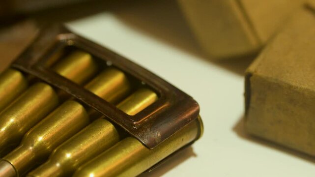 Close-Up Pan of Vintage Rifle Ammunition Clip in Museum Display