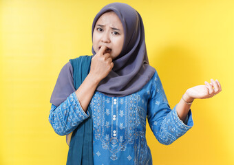 Woman in hijab with disgusted expression.