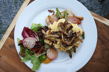 Close up scrambled egg with toast, grilled mushroom and salad