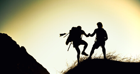 Hiking, silhouette or people on cliff with support, together or motivation for exploration goals. Adventure, journey or friend on mountain with climb, endurance or helping hand for trekking milestone