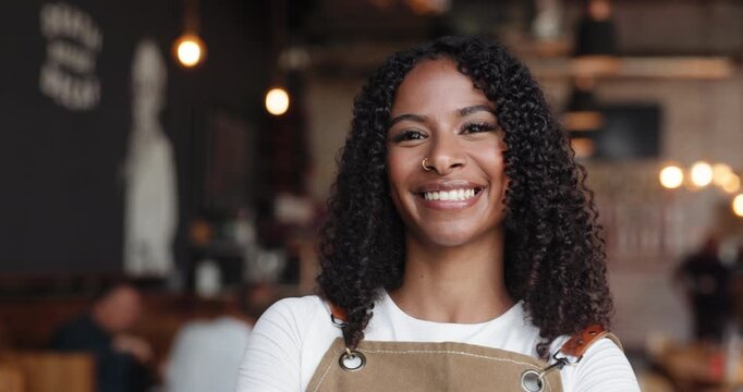Face, barista and woman in cafe with smile, confidence and about us with career pride in startup. Portrait, waitress and happy person in coffee shop, hospitality or customer service in small business