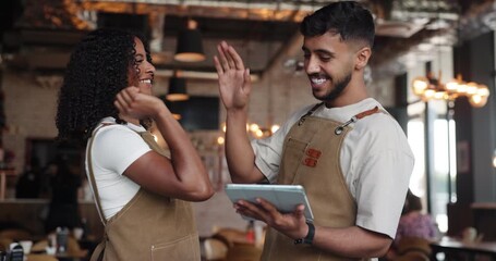 High five, barista and team with tablet in coffee shop for sale, achievement or online tip. Cafe, man and woman with tech for celebration in small business, hospitality goal or excited for success - Powered by Adobe