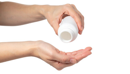Hands Pouring Pills from a White Container into Palm for Health and Wellness Purposes