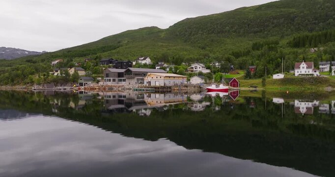Construction of wooden pier at Tromso, coastal town. Drone view, housing, Norway. Marine