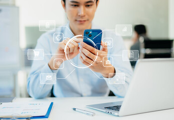Digital marketing media in virtual screen.businesswoman hand working with mobile phone and modern compute with VR icon diagram at office in morning light