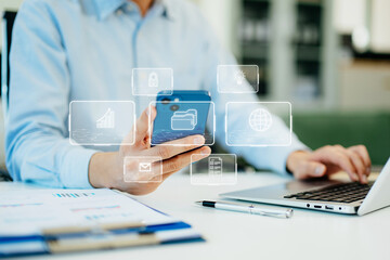 Digital marketing media in virtual screen.businesswoman hand working with mobile phone and modern compute with VR icon diagram at office in morning light