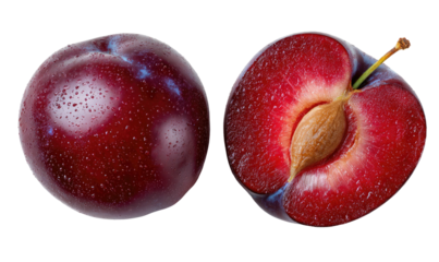 Ripe purple plum, whole and halved, revealing seed