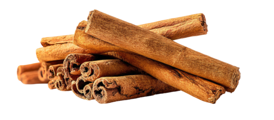 A pile of cinnamon sticks against a black background