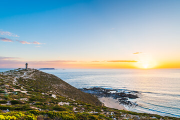 Cape Spencer Lighthouse at golden hour with dramatic cliffs and ocean waves, Innes National Park, Yorke Peninsula, South Australia